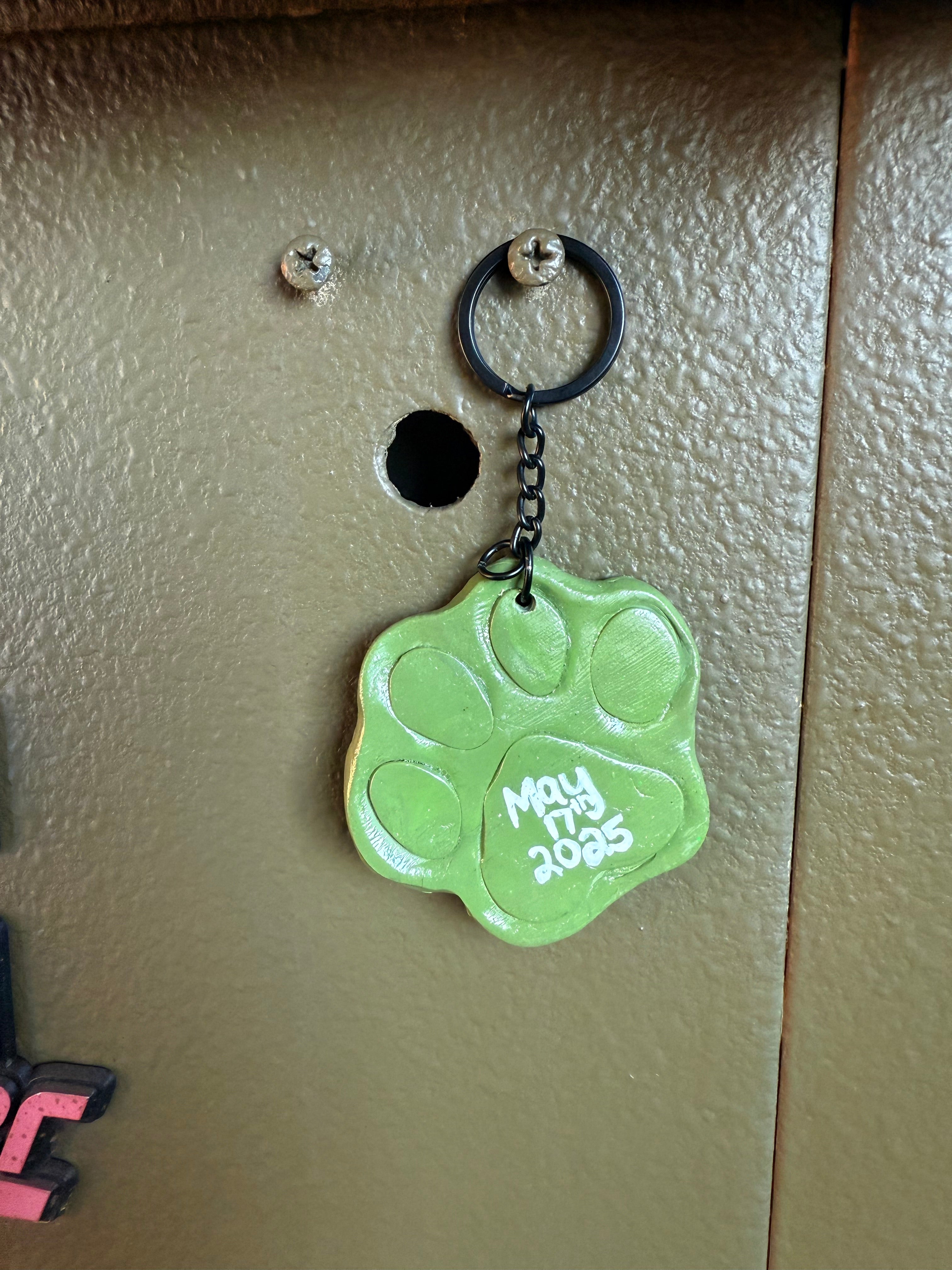 Paw Print keychain with Neil’s Logo