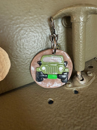 Green Jeep keychain with Neil’s Logo
