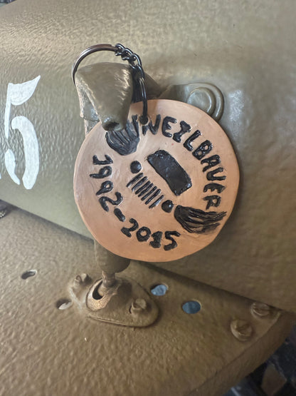 Green Jeep keychain with Neil’s Logo