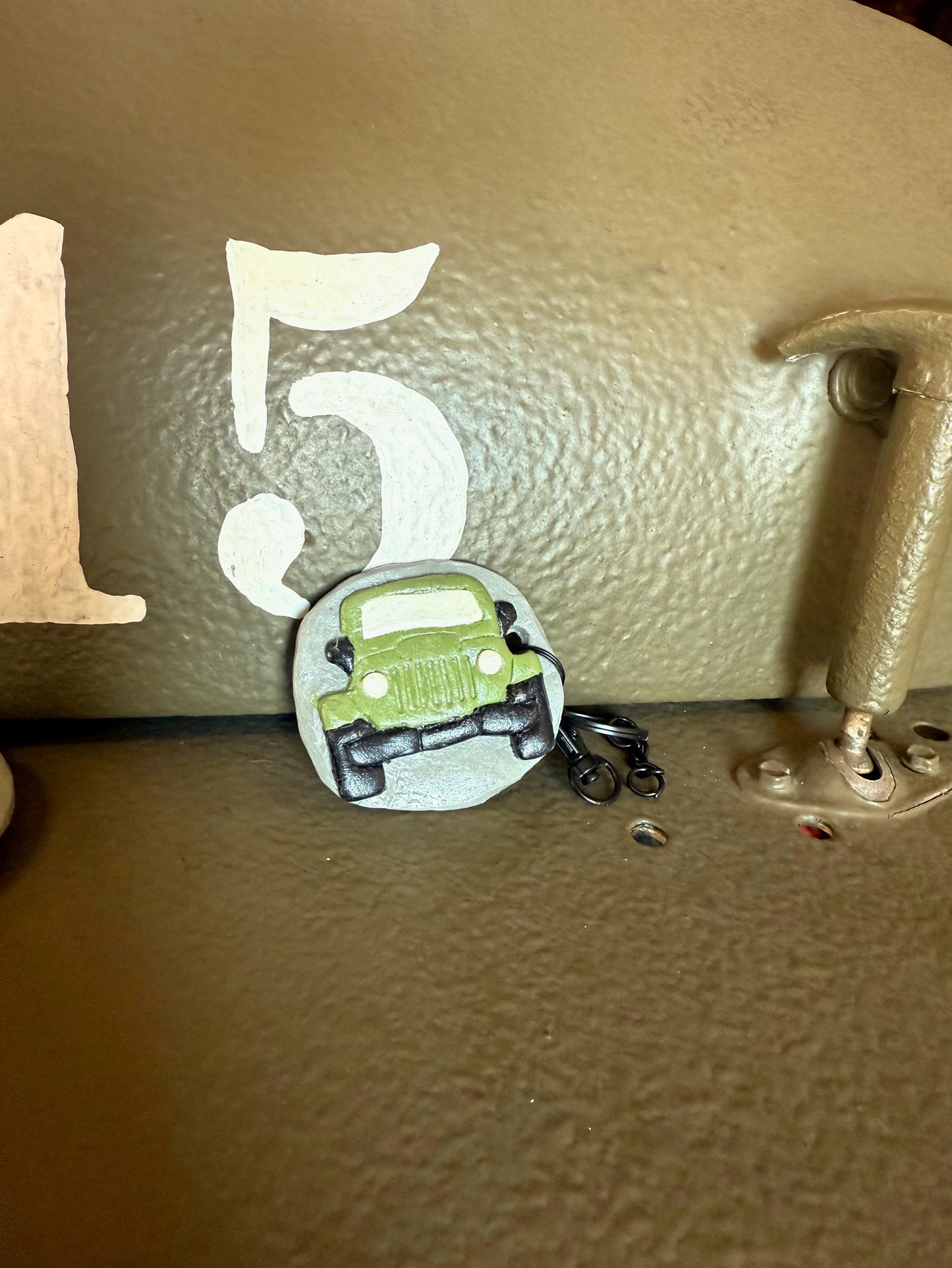 Green Jeep keychain with Neil’s Logo