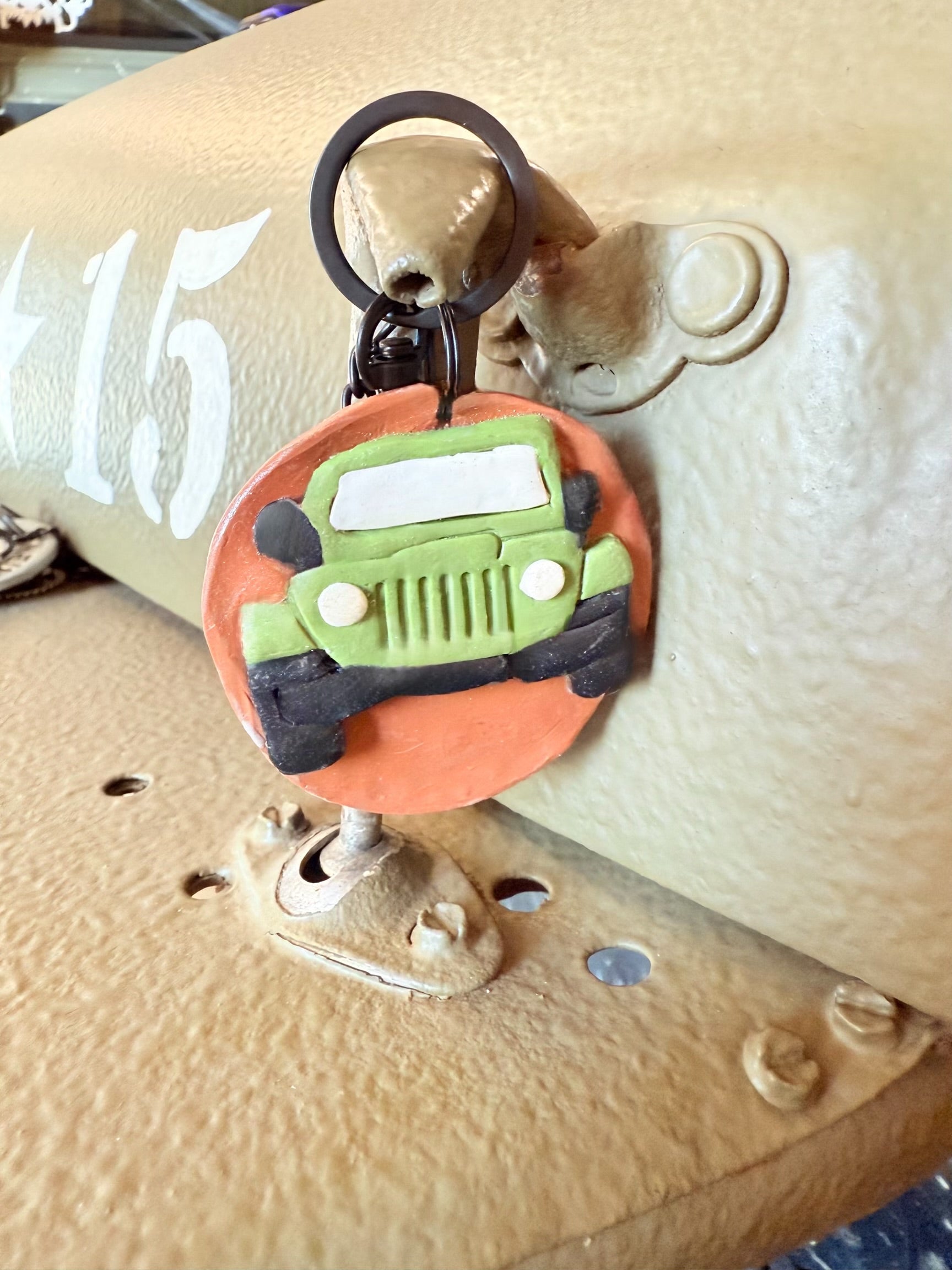 Green Jeep keychain with Neil’s Logo