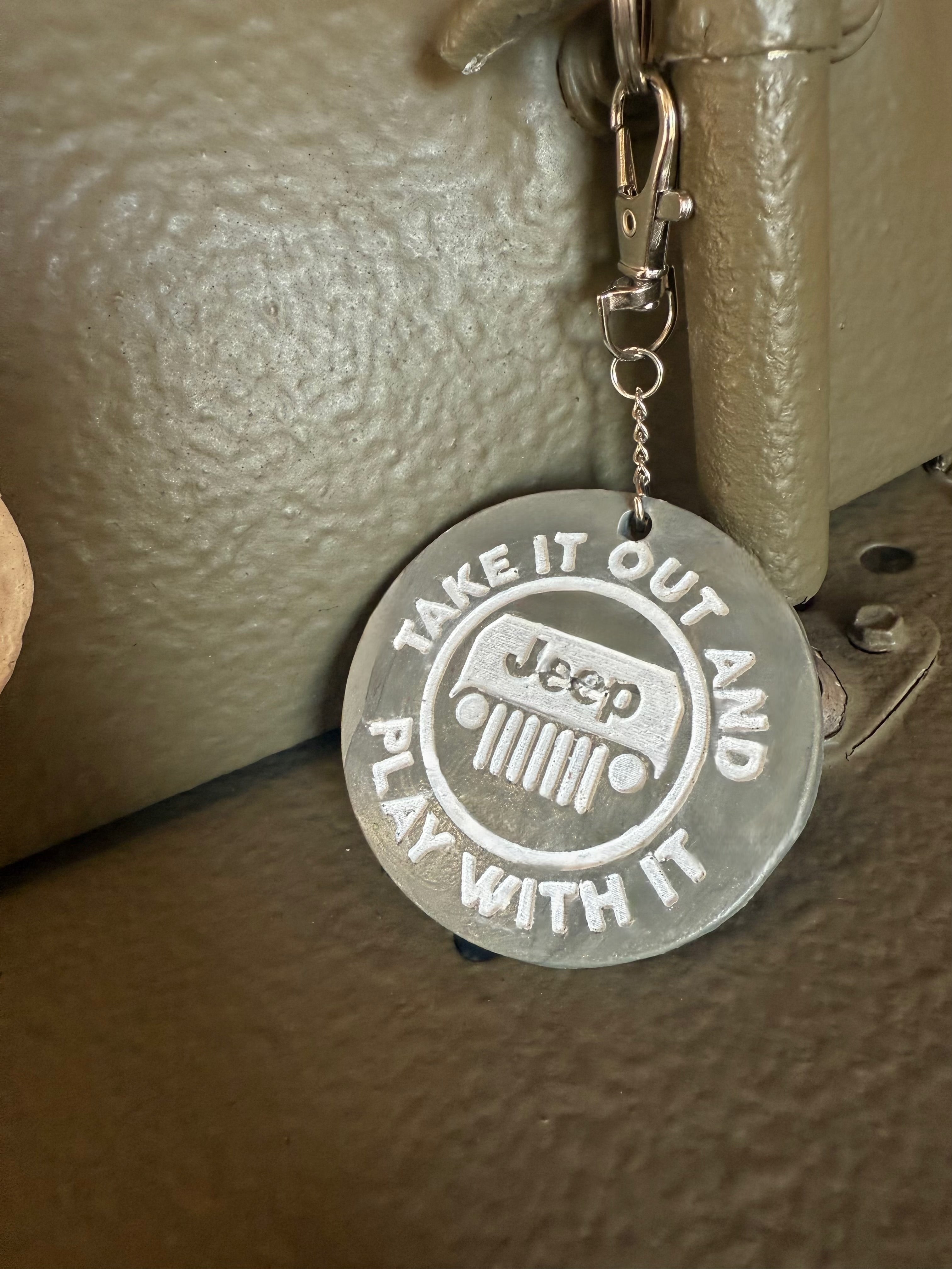 Take It Out And Play With It keychain with Neil’s Logo